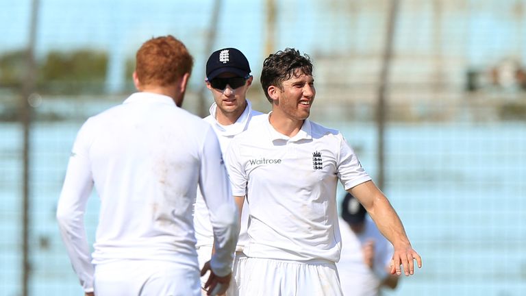 England XI cricketer congratulate Zafar Ansari (2R) after the dismissal of the BCB XI cricketer Nazmul Hossain Shanto during on the first day of the second