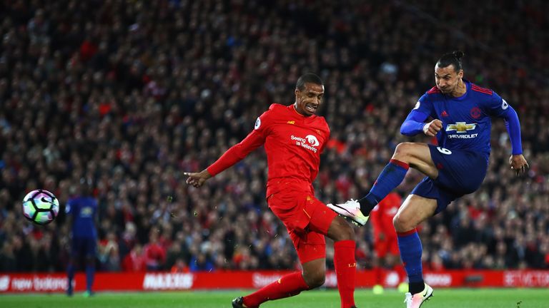 LIVERPOOL, ENGLAND - OCTOBER 17:  Joel Matip of Liverpool closes down Zlatan Ibrahimovic of Manchester United as he shoots during the Premier League match 