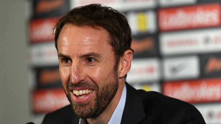 BURTON-UPON-TRENT, ENGLAND - OCTOBER 03:  Interim England manager, Gareth Southgate smiles during an England press conference at St George's Park on Octobe