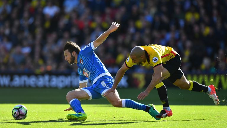 WATFORD, ENGLAND - OCTOBER 01: Harry Arter of AFC Bournemouth and Nordin Amrabat of Watford battle for possession during the Premier League match between W