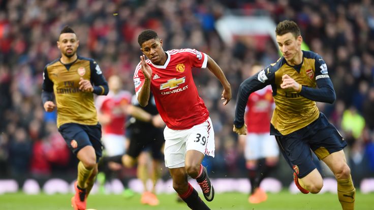 FEBRUARY 28 2016: Marcus Rashford of Manchester United runs for the ball with Laurent Koscielny of Arsenal