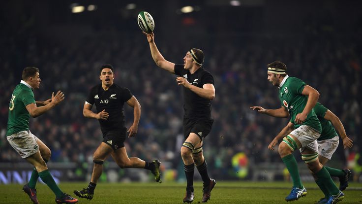 Brodie Retallick of New Zealand throws a one handed pass 