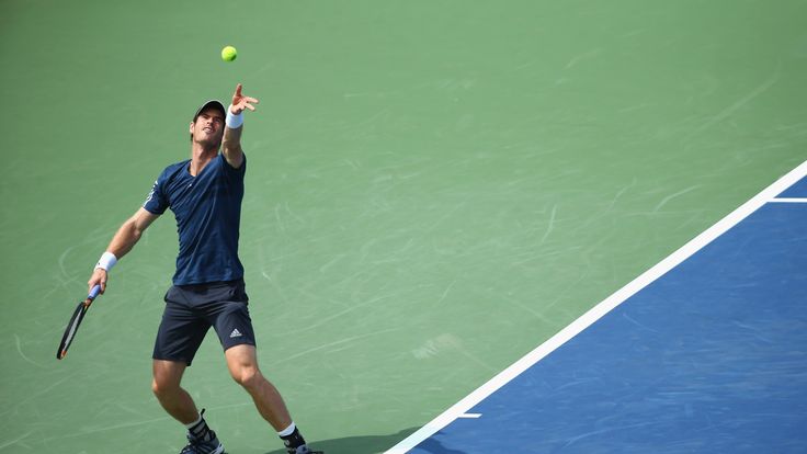 Andy Murray of Scotland hits a serve in the match against John Isner on Day 6 at the Western & Southern Open