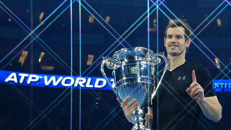 Britain's Andy Murray poses holding the ATP World Number One trophy after winning the men's singles final against Serbia's Novak Djokovic