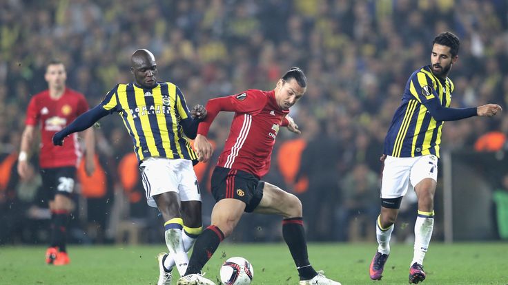 ISTANBUL, TURKEY - NOVEMBER 03:  Zlatan Ibrahimovic of Manchester United battles for the ball with Alper Potuk and Moussa Sow of Fenerbahce during the UEFA