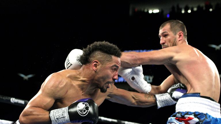 Andre Ward (L) of the US connect with a left against Sergey Kovalev (R) of Russia during their WBA, IBF and WBO lightheavyweight world championship fight o