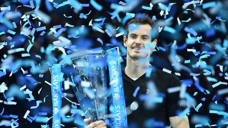 Andy Murray celebrates with the trophy after winning the men's singles final on the eighth and final day of the ATP World Tour Finals