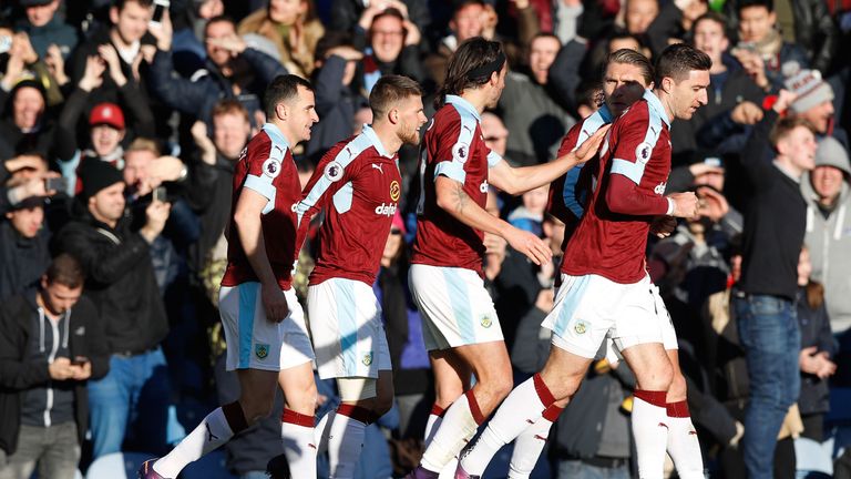 Dean Marney celebrates the opening goal against Manchester City