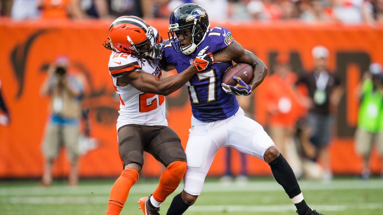 CLEVELAND, OH - SEPTEMBER 18: Cornerback Tramon Williams #22 of the Cleveland Browns tackles wide receiver Mike Wallace #17 of the Baltimore Ravens at Firs