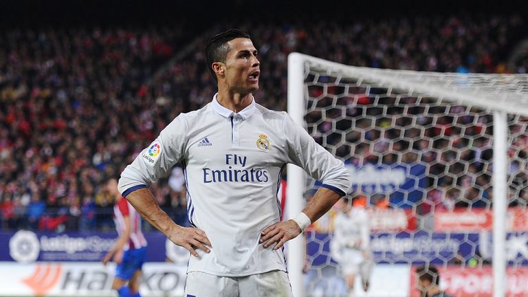 Cristiano Ronaldo of Real Madrid celebrates after scoring Real's 3rd goal during the La Liga match at Atletico Madrid