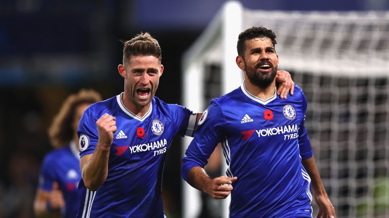 Diego Costa of Chelsea (R) celebrates scoring his side's third goal with Gary Cahill during the Premier League match v Everton