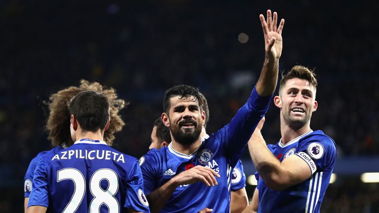 Diego Costa celebrates scoring his side's third goal with his Chelsea team-mates during the Premier League match v Everton