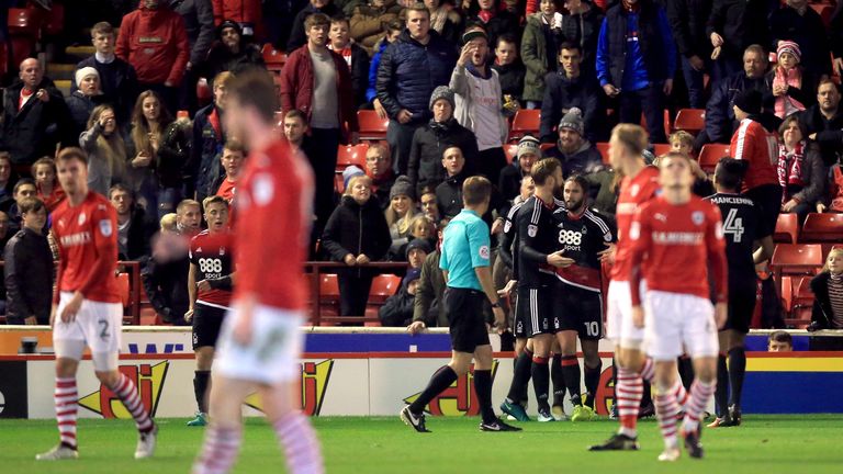 Nottingham Forest's Henri Lansbury celebrates scoring his side's third goal of the game with his team-mates as Barnsley's players stand dejected