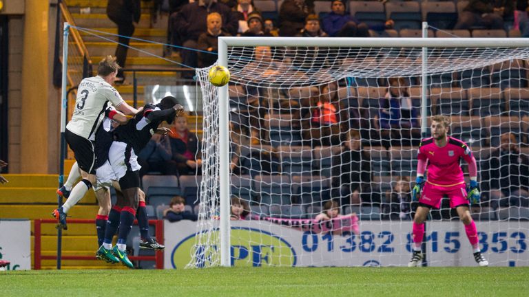 Carl Tremarco (3) pulls a goal back for Inverness
