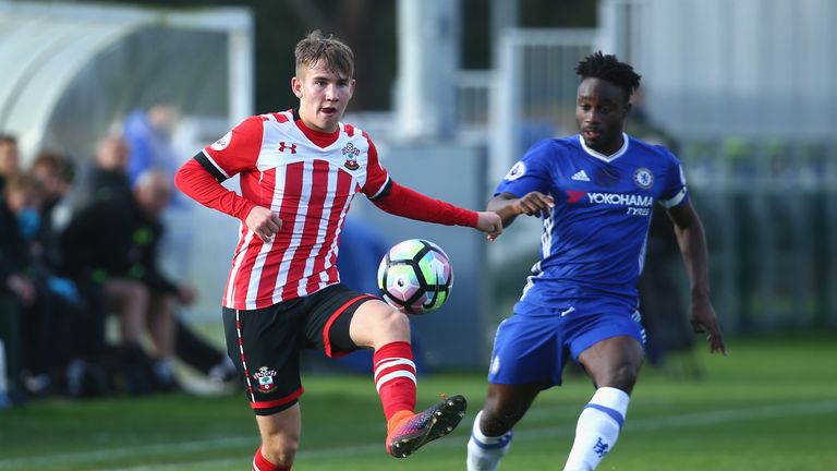 COBHAM, ENGLAND - NOVEMBER 21 2016:  Jake Vokins of Southampton is closed down by Fankaty Dabo of Chelsea during the Premier League 2 match 