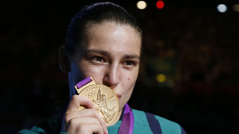 Katie Taylor of Ireland  celebrates her gold medal victory over Sofya Ochigava of Russia in the women's boxing Lightweight final of the 2012 London Olympic