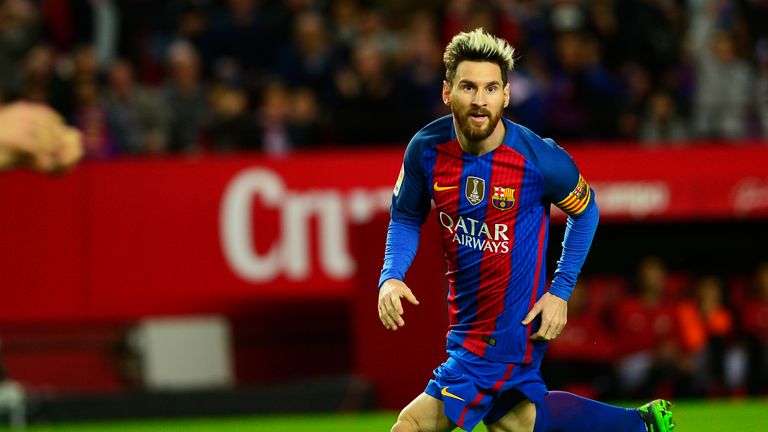 Lionel Messi celebrates after scoring during the Spanish league football match Sevilla FC vs FC Barcelona