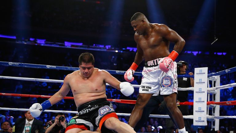 NEW YORK, NY - OCTOBER 17:  Luis Ortiz knocks down Matias Ariel Vidondo in the second round during their WBA Interim Heavyweight title fight at Madison Squ