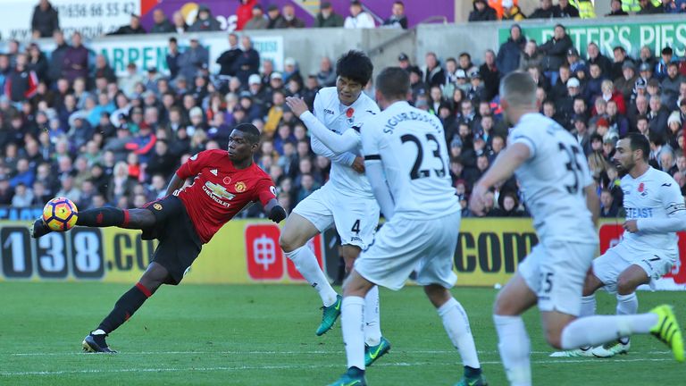 Manchester United's Paul Pogba scores his side's first goal during the Premier League match at the Liberty Stadium, Swansea