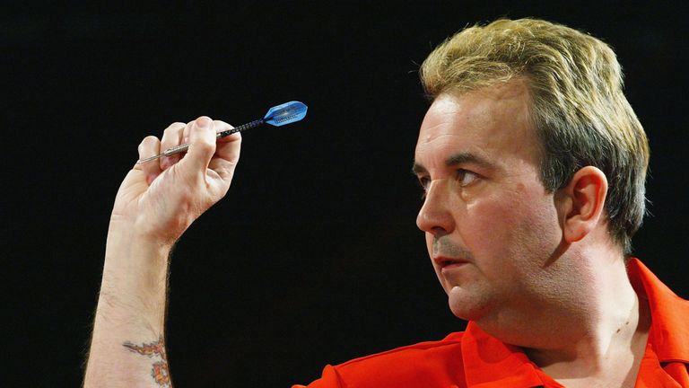 PURFLEET, ENGLAND - DECEMBER 30:  Phil Taylor of England in action against Colin McGarry of Northern Ireland during the third round of the 2004 Ladbrokes.c