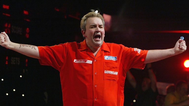 PURFLEET, ENGLAND - JANUARY 3:  Phil Taylor of England celebrates his victory against Wayne Mardle of England during the Semi Finals of the 2004 Ladbrokes.