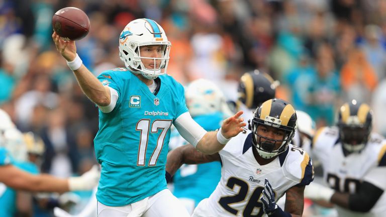 Quarterback Ryan Tannehill #17 of the Miami Dolphins makes a short pass play in front of Mark Barron #26 of the Los Angeles Rams