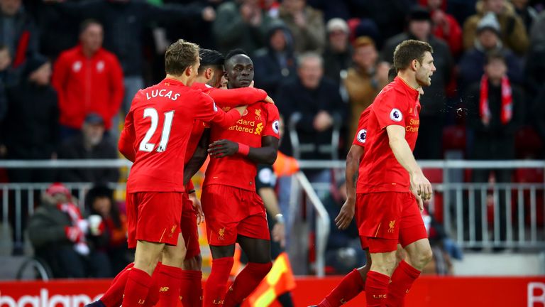 Sadio Mane of Liverpool celebrates scoring his second and his side's fifth goal with team-mates during the Premier League match v Watford