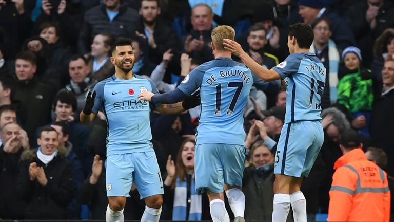 Sergio Aguero (L) celebrates scoring the opening goal during the Premier League football match between Manchester City and Middlesbrough