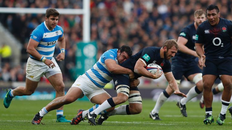 Agustin Creevy looks to bring down England's Chris Robshaw