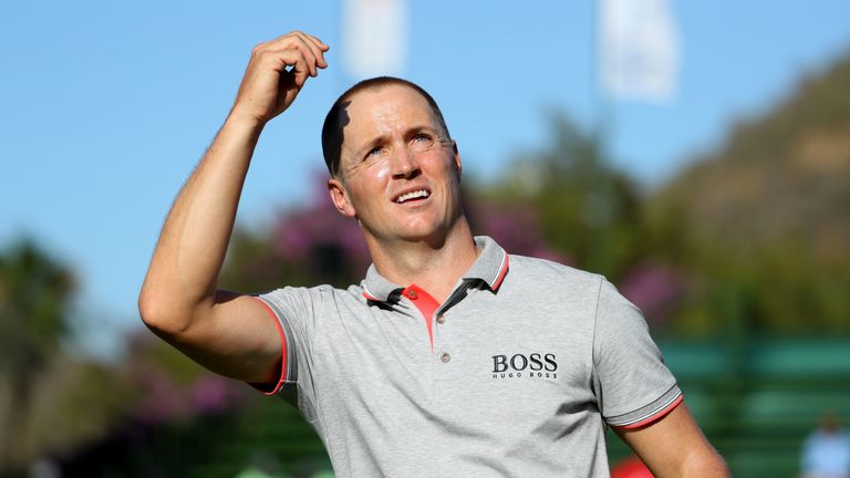 SUN CITY, SOUTH AFRICA - NOVEMBER 13:  Alex Noren of Sweden throws his ball to the crowd after his victory on the 18th green during day four of the Nedbank
