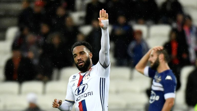 Lyon's French forward Alexandre Lacazette (C) celebrates after scoring a goal during the French L1 football match Olympique Lyonnais (OL) vs Bastia  on Nov