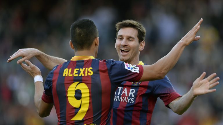 Alexis Sanchez (left) says he likes playing in the same way as Lionel Messi (right) at Barcelona