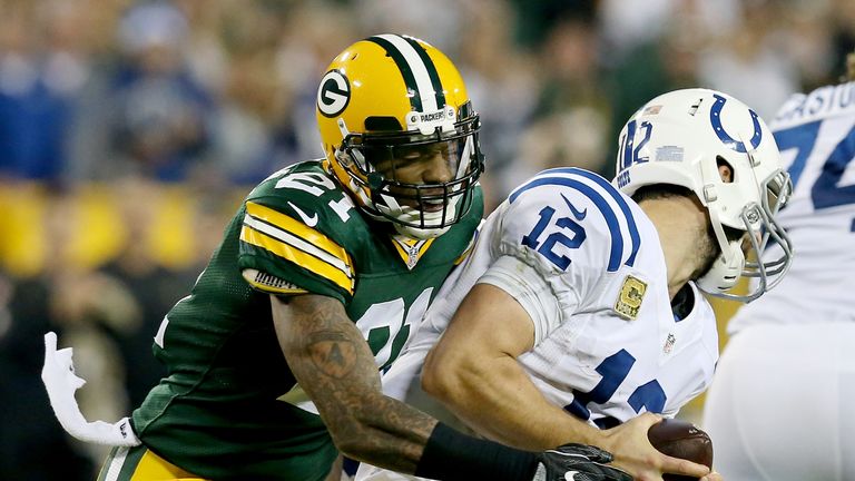 GREEN BAY, WI - NOVEMBER 06:  Andrew Luck #12 of the Indianapolis Colts avoids a tackle attempt by Ha Ha Clinton-Dix #21 of the Green Bay Packers in the fo