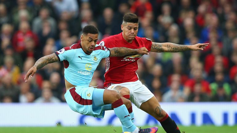 Marcos Rojo keeps an eye on Andre Gray at Old Trafford