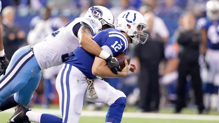 INDIANAPOLIS, IN - NOVEMBER 20:  Andrew Luck #12 of the Indianapolis Colts is tackled as he runs with the ball in the second quarter of the game against th