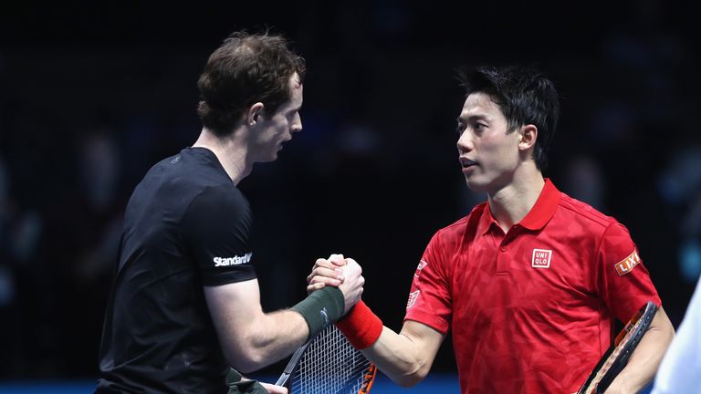 Andy Murray of Great Britain shakes hands with Kei Nishikori of Japan after their mens singles match on day four of the ATP