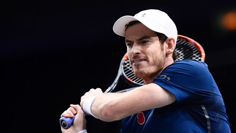 Andy Murray returns the ball to John Isner during the ATP World Tour Masters 1000
