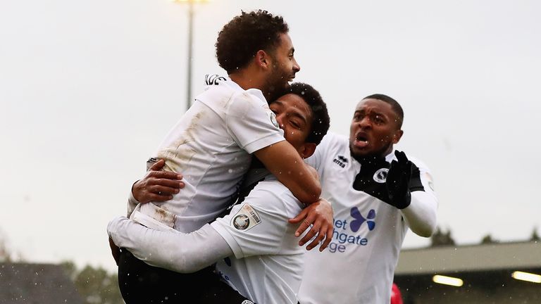 Angelo Balamta of Boreham Wood is congratulated on scoring his teams second goal