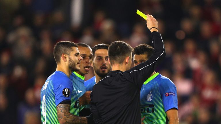 SOUTHAMPTON, ENGLAND - NOVEMBER 03:  Antonio Candreva of Internazionale is shown a yellow card during the UEFA Europa League Group K match between Southamp