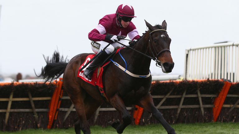 Bryan Cooper on his way to victory on Apple'sJade in the Betfred Anniversry Juvenile hurdle race at Aintree 