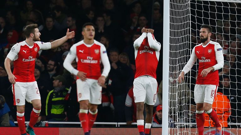 Arsenal's Nigerian striker Alex Iwobi (2R) reacts after deflecting the ball from Paris Saint-Germain's Brazilian midfielder Lucas Moura's header for Paris'