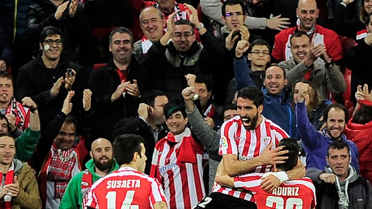 Athletic Bilbao's midfielder Raul Garcia (C) celebrates with midfielder Markel Susaeta (L) and forward Aritz Aduriz after scoring their team's first goal d