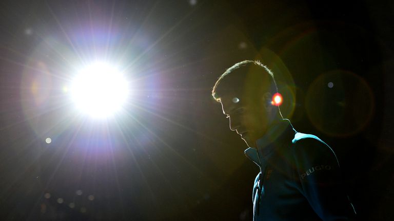 Novak Djokovic of Serbia makes his way onto court for his Mens Singles quarter final match against Marin Cilic of Croatia