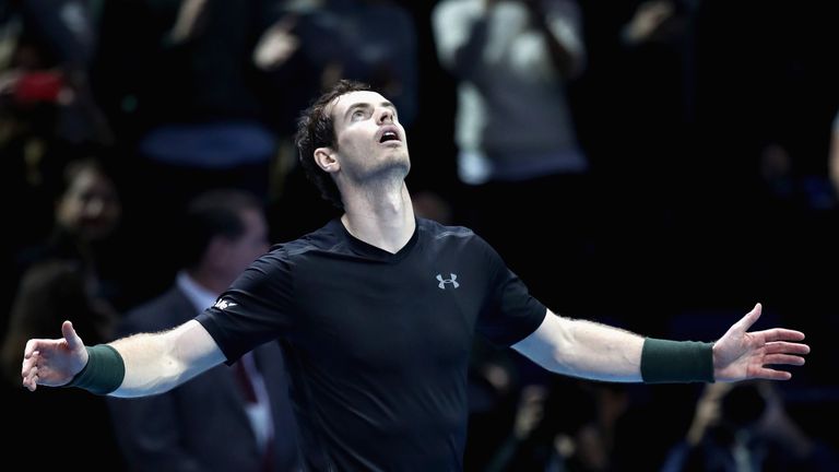 Andy Murray of Great Britain celebrates defeating Milos Raonic of Canada