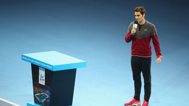 Roger Federer of Switzerland announces his decision to withdraw from the singles final match against Novak Djokovic