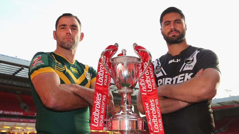 Cameron Smith the captain of Australia and Jesse Bromwich the captain of New Zealand with the Four Nations trophy 
