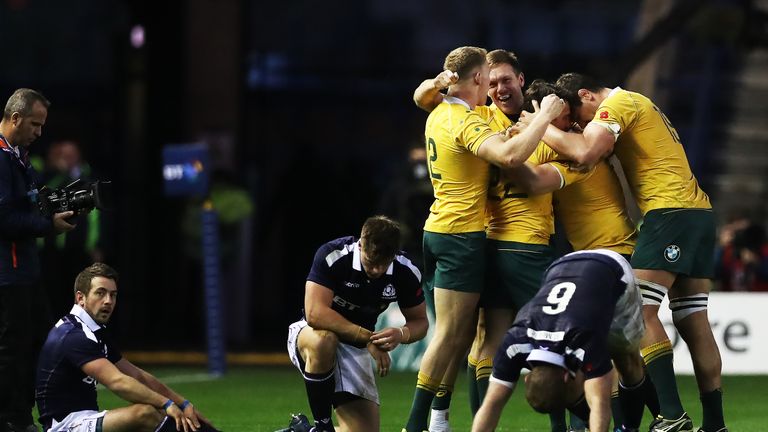 Greig Laidlaw of Scotland  looks on as Australia celebrate