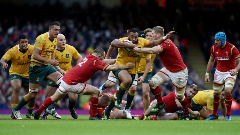 Australia's Tevita Kuridrani is tackled by Wales Ken Owens and Bradley Davies during the Autumn International match at the Principality Stadium, Cardiff.