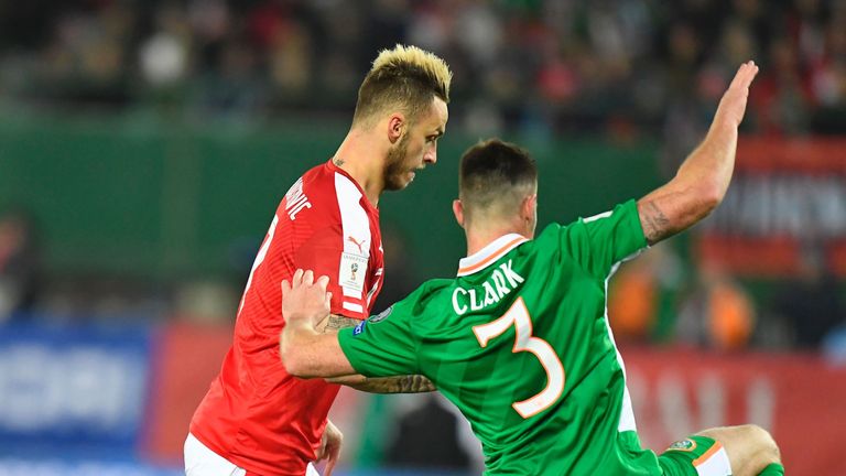 Austria's Marko Arnautovic (L) and Ireland's Ciaran Clark vie for the ball 