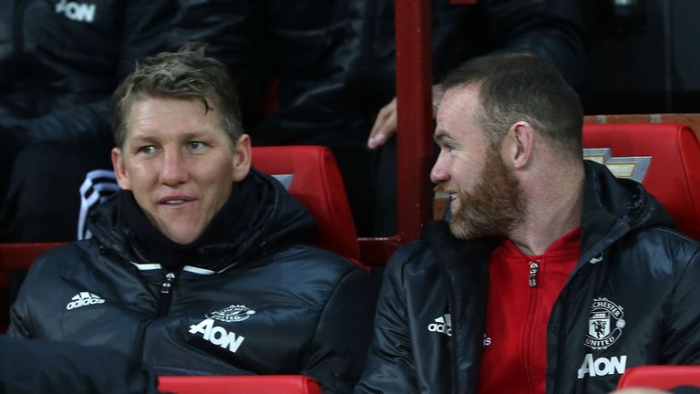 Bastian Schweinsteiger - back in the Manchester United fold - watches on from the bench against West Ham alongside Wayne Rooney